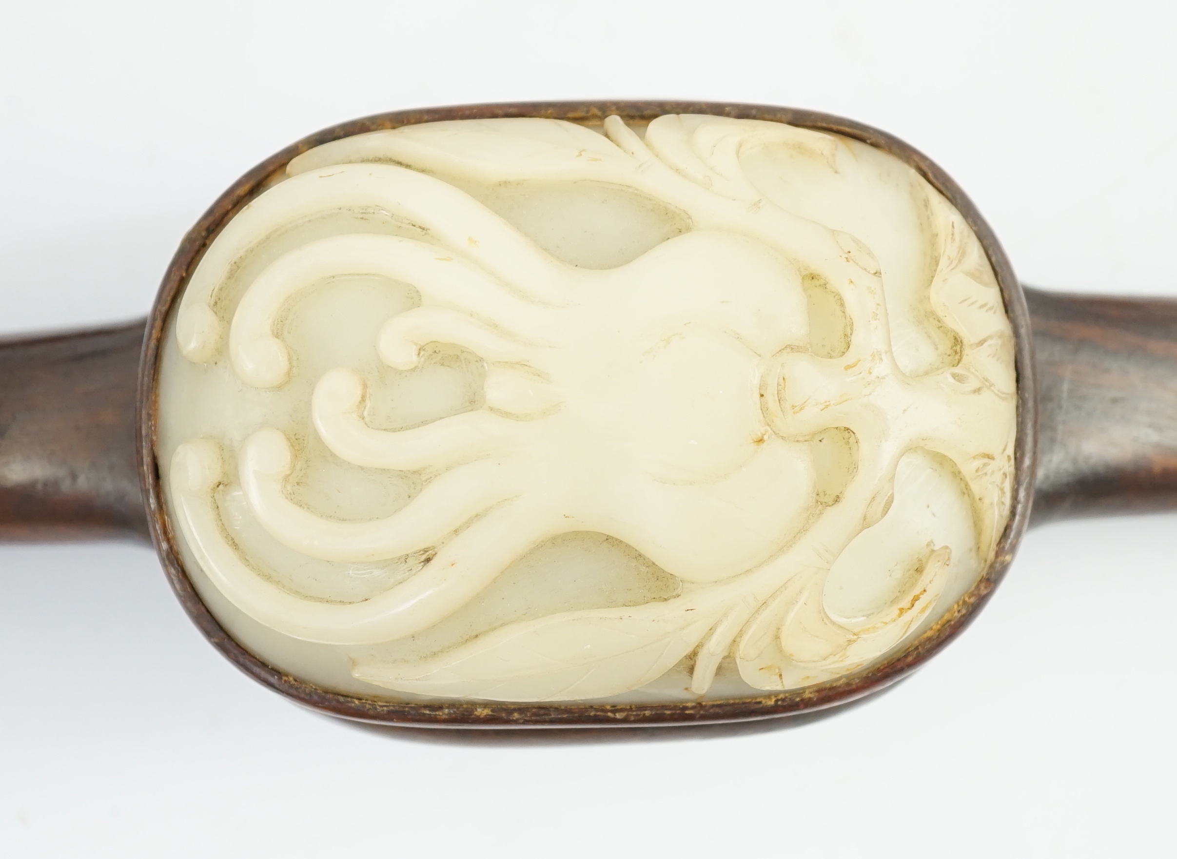 A Chinese pale celadon jade and zitan ‘sanduo’ ruyi sceptre, 18th/19th century